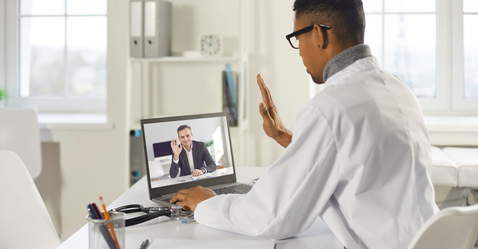 A doctor on the computer on a virtual appointment