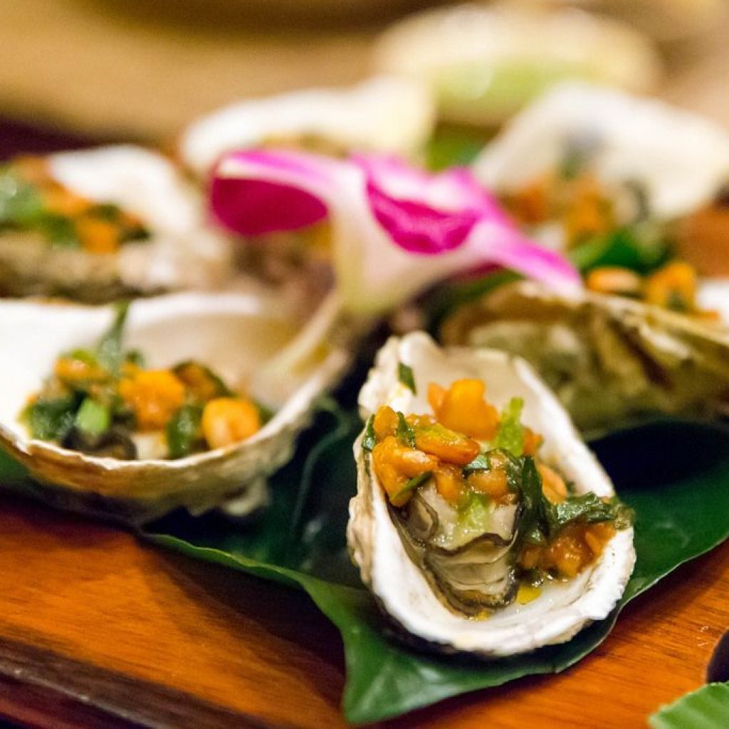 Oysters filled with spring onion salsa