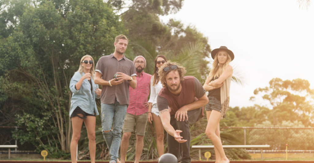 Group playing croquet