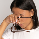 Woman rubbing her eyes
