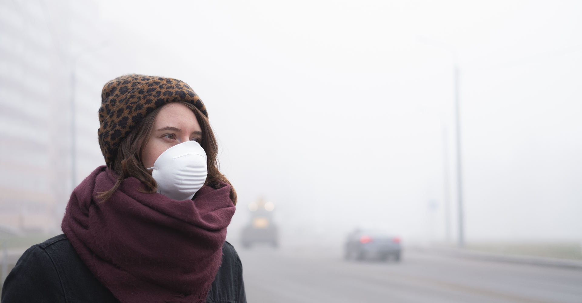 Woman walking in pollution with mask on