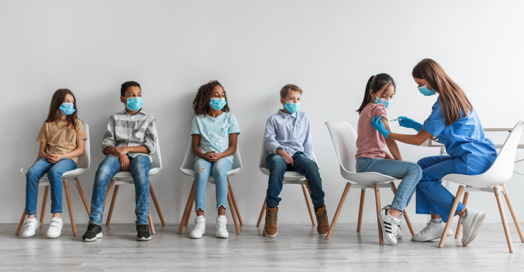 Children lining up for vaccines