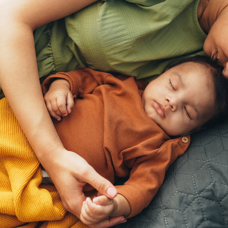 Mother and baby napping