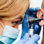 Doctor performing a hearing test